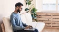 Handsome young man using laptop computer at home, Businessman warking in his room, Home work or study, freelance concept Royalty Free Stock Photo