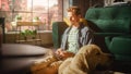 Handsome Young Man Using Laptop, Working from Home Living Room. Male Sitting on Floor, Using Royalty Free Stock Photo