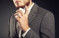 Handsome young man using perfume Royalty Free Stock Photo