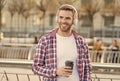 handsome young man wear headphones and smiling while listening music and drinking coffee, morning inspiration. Royalty Free Stock Photo