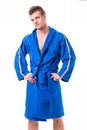 Handsome young man wearing blue bathrobe, isolated Royalty Free Stock Photo