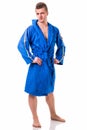 Handsome young man wearing blue bathrobe, isolated Royalty Free Stock Photo