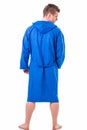 Handsome young man wearing blue bathrobe, isolated Royalty Free Stock Photo