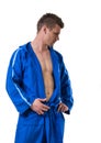 Handsome young man wearing blue bathrobe Royalty Free Stock Photo