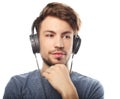 Handsome young man wearing headphones and listening to music. Royalty Free Stock Photo