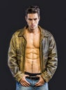 Handsome young man wearing leather jacket on naked