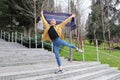 Handsome young man wearing make up, dancing and holding cotton scarf Royalty Free Stock Photo