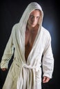 Handsome young man wearing white bathrobe Royalty Free Stock Photo