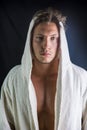 Handsome young man wearing white bathrobe Royalty Free Stock Photo