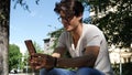 Young man doing videochat outdoor on his mobile phone