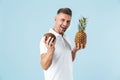 Handsome young man wearing white t-shirt standing Royalty Free Stock Photo