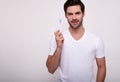 Smiling man brushing his teeth with a toothbrush on white background Royalty Free Stock Photo