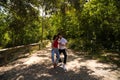 Handsome young man and woman dancing bachata and salsa in the park. The couple dance passionately surrounded by greenery. Dancing Royalty Free Stock Photo