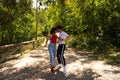 Handsome young man and woman dancing bachata and salsa in the park. The couple dance passionately surrounded by greenery. Dancing Royalty Free Stock Photo