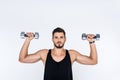 handsome young man working out with dumbbells Royalty Free Stock Photo