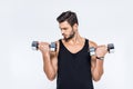 handsome young man working out with dumbbells Royalty Free Stock Photo