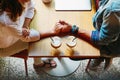 Romantic couple in cafe is drinking coffee and enjoying being together Royalty Free Stock Photo