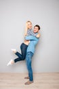 Handsome young man carrying his pretty girlfriend Royalty Free Stock Photo