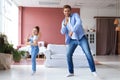 Handsome young man dancing at home with his little cute daugther Royalty Free Stock Photo