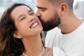 Handsome young man kissing his beautiful girlfriend, closeup Royalty Free Stock Photo