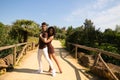 Handsome young man and woman dancing bachata and salsa in the park. The couple dance passionately surrounded by greenery. Dancing Royalty Free Stock Photo