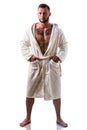 Handsome muscular young man wearing white bathrobe, isolated Royalty Free Stock Photo