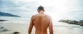 Handsome young muscular italian man posing shirtless on the beach, summer time. Ideal fit body Royalty Free Stock Photo