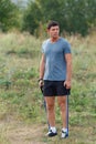 Handsome young muscular sports man exercising outside outdoor with rubber band. Royalty Free Stock Photo