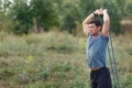 Handsome young muscular sports man exercising outside outdoor with rubber band. Royalty Free Stock Photo