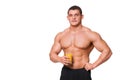 Handsome young muscular sports man holding a glass of juice isolated Royalty Free Stock Photo