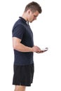 Handsome young personal trainer with tablet PC