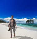 Handsome young pirate walking on beach