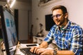 Young programmer working at home late in evening Royalty Free Stock Photo