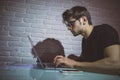 Handsome young programmer working at home late in evening Royalty Free Stock Photo