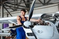Handsome young repair man fixing plane engine Royalty Free Stock Photo