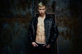 Handsome young shirtless man in leather jacket Royalty Free Stock Photo