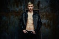 Handsome young shirtless man in leather jacket Royalty Free Stock Photo