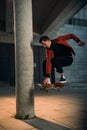 handsome young skateboarder performing jump trick