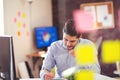 Handsome young smiling businessman working with documents Royalty Free Stock Photo