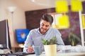 Handsome young smiling businessman working with documents Royalty Free Stock Photo