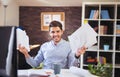 Handsome young smiling businessman working with documents Royalty Free Stock Photo