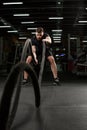 Handsome young strong sports man in gym with ecquipment Royalty Free Stock Photo