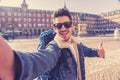 Handsome young student tourist man happy and excited taking a selfie in Madrid, Spain Royalty Free Stock Photo