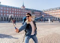 Handsome young student tourist man happy and excited taking a selfie in Madrid, Spain Royalty Free Stock Photo