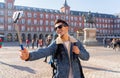 Handsome young student tourist man happy and excited taking a selfie in Madrid, Spain Royalty Free Stock Photo