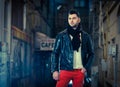 Handsome young stylish guy .Vogue style photo of a handsome man on the street.Young attractive man in urban background Royalty Free Stock Photo