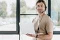 handsome young support hotline worker with laptop Royalty Free Stock Photo