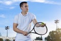 Handsome young tennis player dressed in white Royalty Free Stock Photo