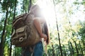 Young traveler girl hold location map in hands and looking directional way for traveling with backpack Royalty Free Stock Photo