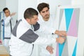 handsome young worker painting color wall Royalty Free Stock Photo